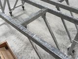 a large metal structure that is sitting in a warehouse