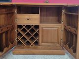 a wooden cabinet with a wine rack inside of it