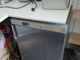 an image of a small kitchen with a dishwasher and a stove