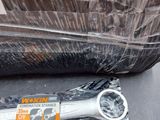 a pair of wrenches sitting on a table in a plastic bag