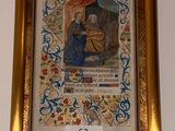 framed picture of a painting of a woman and child in a golden frame