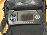 a black bag with a video game system inside of it