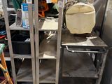 a metal shelf with a bag on top of it
