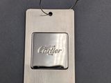 a close up of a metal keychain with a logo on it