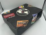 a black box with stickers on it sitting on a white surface