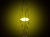 a close up of a lamp on a table with a black background