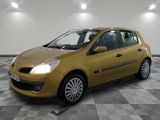 the small yellow car is parked in the room on the checkered floor