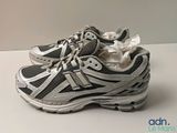 a pair of new balance running shoes on a table