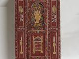 an image of a red cabinet with gold decorations on it