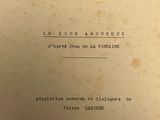 a close up of an old book with writing on it