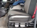 a picture of a seat in a car with a red seat belt