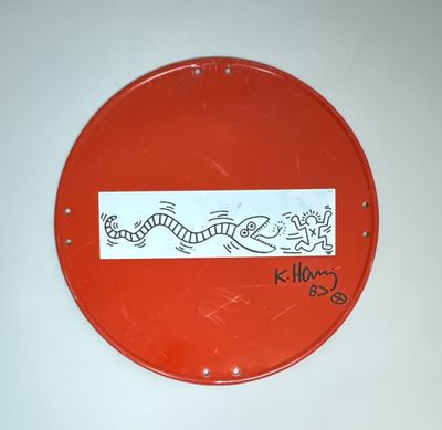 a red sign with a drawing of a fish on it