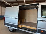 a white van with its doors open in a garage