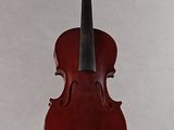 a red violin that is sitting on a stand