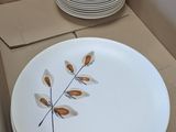 a lot of plates in a box that are sitting on a table