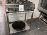 an image of a kitchen with two stoves and a pot on a stand