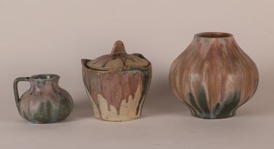 three vases that are sitting next to each other on a table
