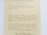 an old document with writing on it sitting on a table