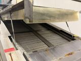 a machine that has a conveyor belt on it