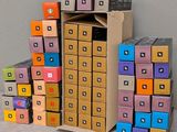 many boxes stacked on top of each other on the floor