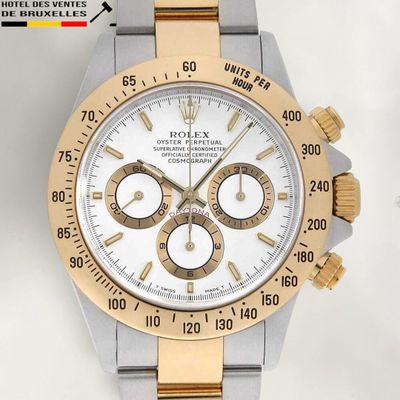 a gold and silver rolex watch with a white dial