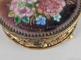 a picture of a small box with flowers painted on it