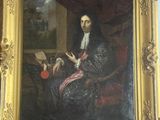tableau représentant un homme en manteau noir assis sur une chaise avec un chien