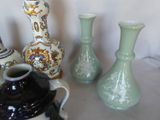 three vases sitting on a table next to each other