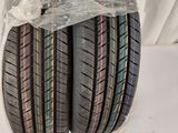 a couple of tires sitting on top of each other on a white surface