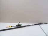 a fishing rod on the floor next to a fishing pole
