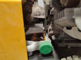 a close up of a machine with a green cap on it