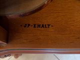 a wooden table with a mirror on top of it