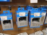many boxes of electronic devices on display in a store
