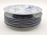 several plates stacked on top of each other on a white surface