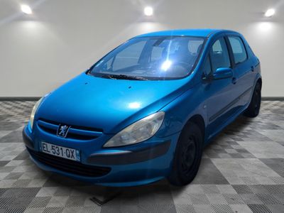 a picture of a blue car parked in a garage