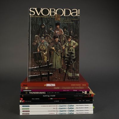 several books are stacked on top of each other on a table