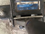 a close up view of a machine with a blue label on it