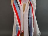striped scarf on a mannequin head on a mannequin display