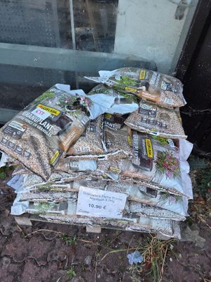 a pile of food sitting on the ground next to a glass door