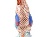 an image of a figurine of a rooster on a white background