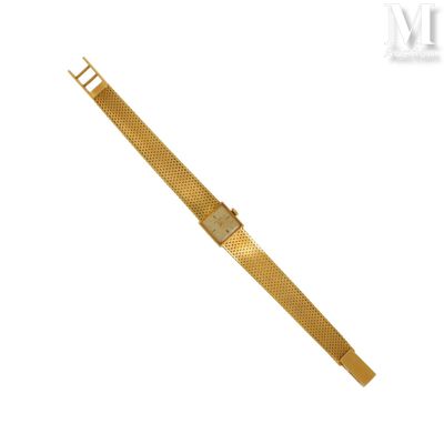 a gold mesh watchband with a square clasp