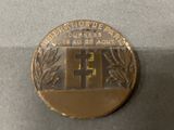 an image of a gold medal with a cross on it