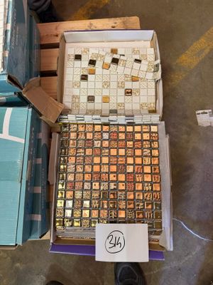 a box of chocolates on a pallet next to a box of chocolates