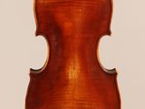 an old violin with a wooden back and a long neck