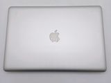a white apple laptop computer sitting on a table