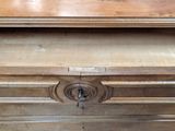a wooden dresser with a drawer on top of it