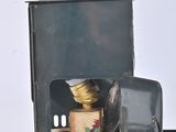 a small stove with a light on top of it