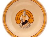 a plate with a picture of a woman holding a basket of fruit