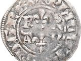 an old silver coin with a circular design on it