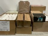 several boxes of toilet paper are stacked on top of each other